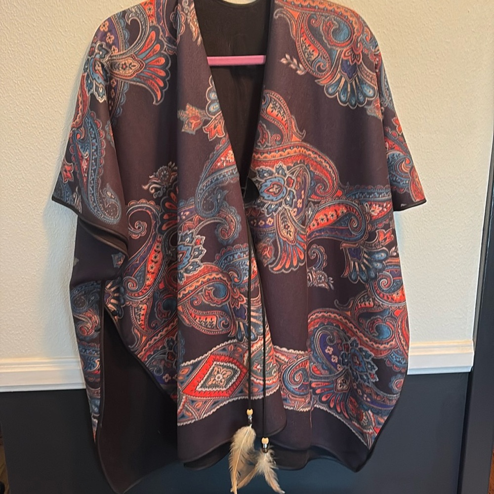 Beautiful designs and colors in this wrap. Buttons on both sides for arms.